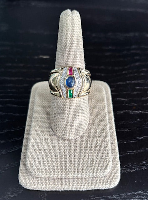 18K Yellow Gold Fabulous Wide Band Ring w/ Cabochon Sapphire=.10CT, 2 Emeralds=.06CT, 2 Rubies=.06CT, & 14D=.07CTTW. Finger Size 9. Estate Collection