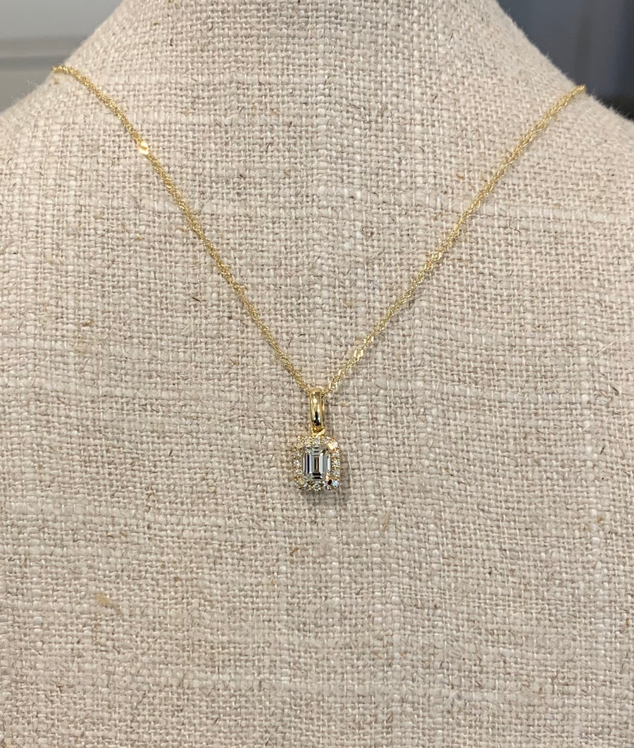 Emerald Cut Diamond Halo Necklace in 18KY on 18" Chain. 1EC=.51CT and 16D=.63CTTW