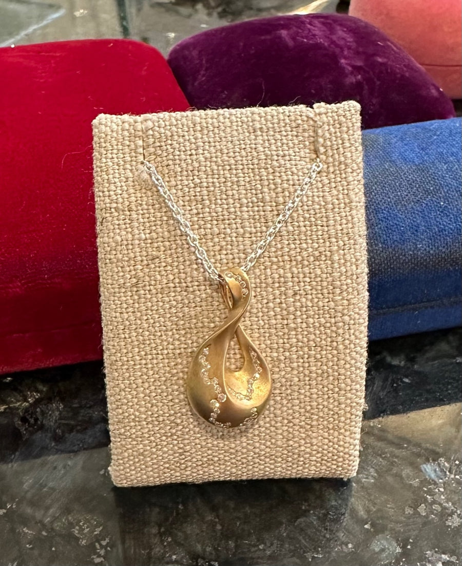 Stunning Golden Wave Necklace in 14K Satin Finish Gold set with 33D=.13CTTW on 20" Sterling Cable Chain. Estate Collection